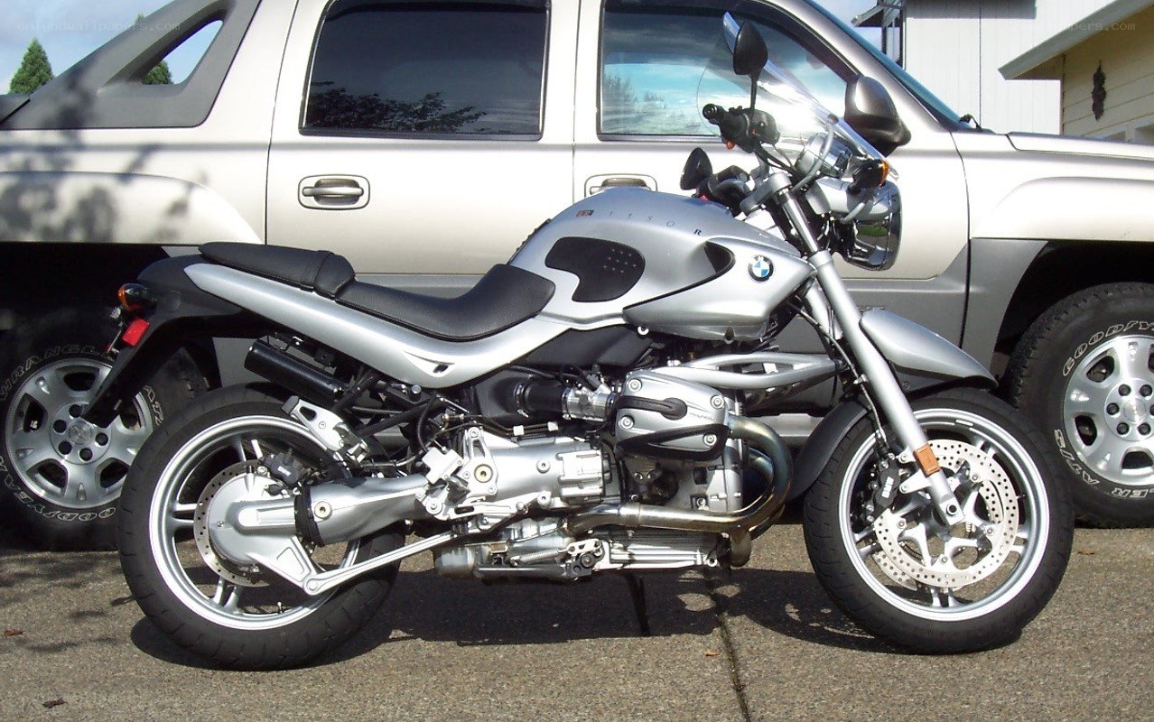 silver BMW motorcycle parked