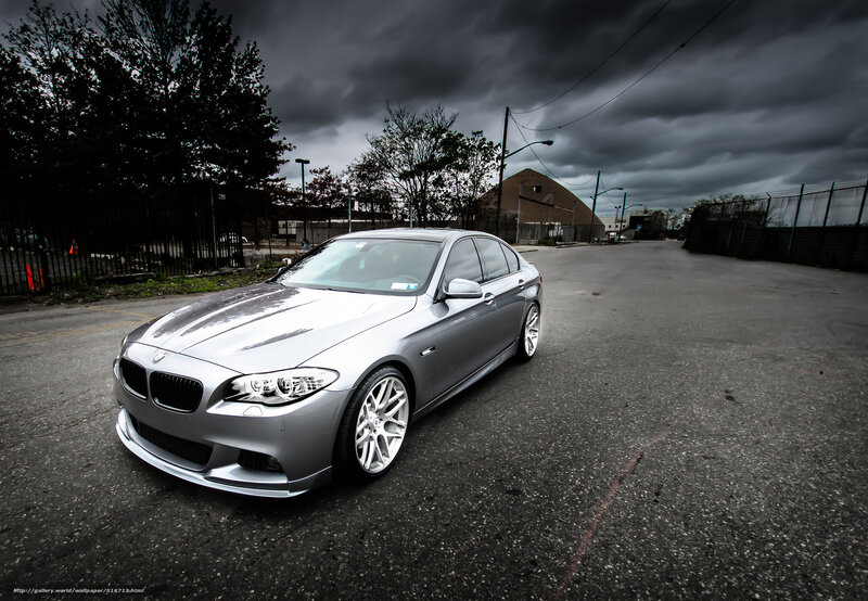 Silver BMW on a cloudy day
