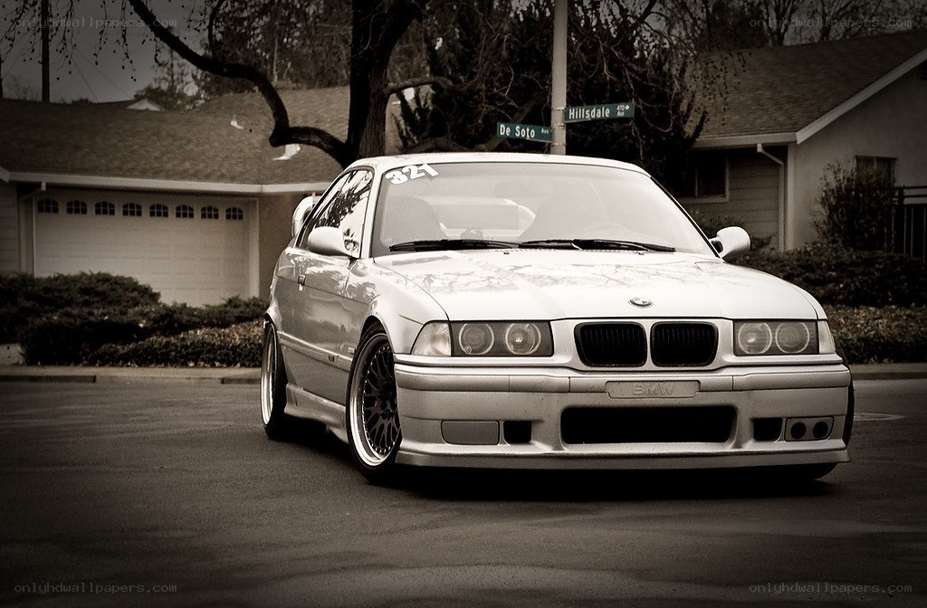 silver bmw on a residential street