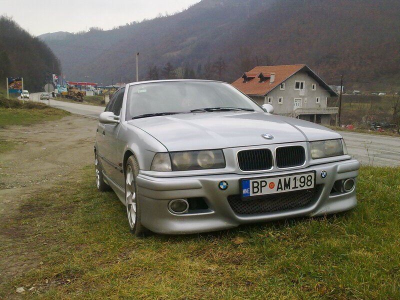 Silver BMW on a roadside