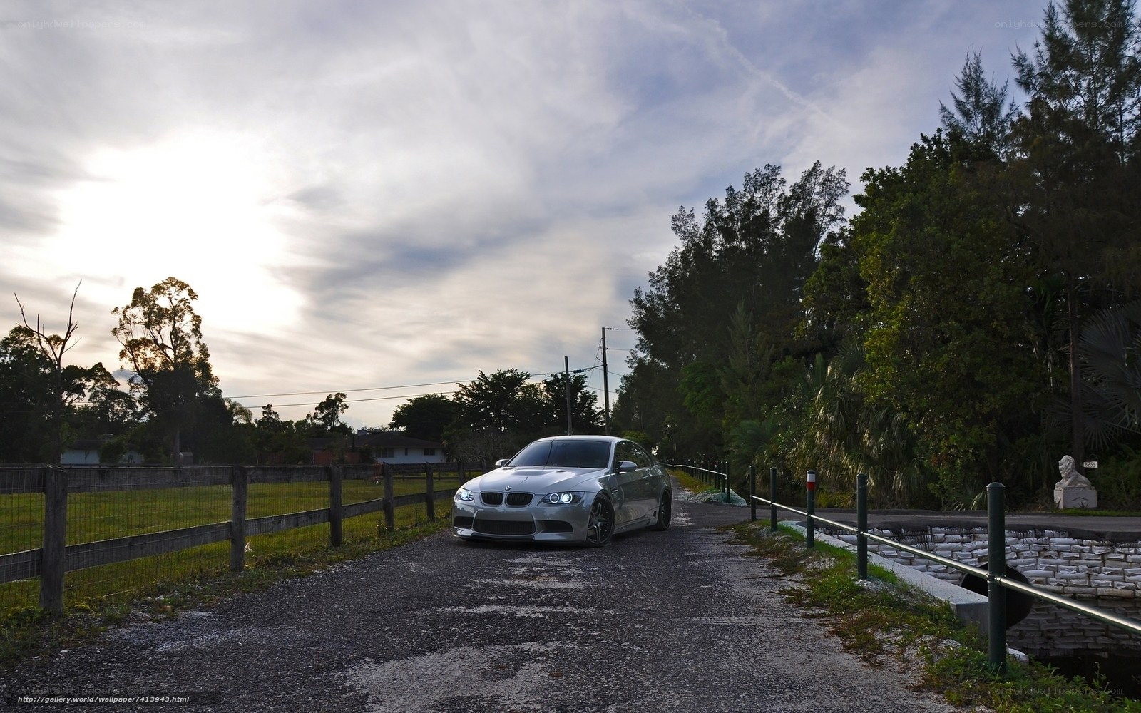 silver bmw on a rural road