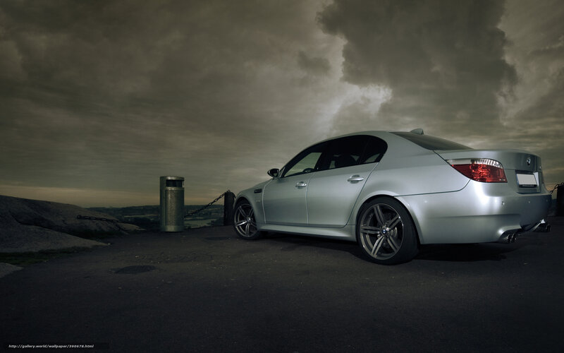 Silver BMW on a stormy overlook