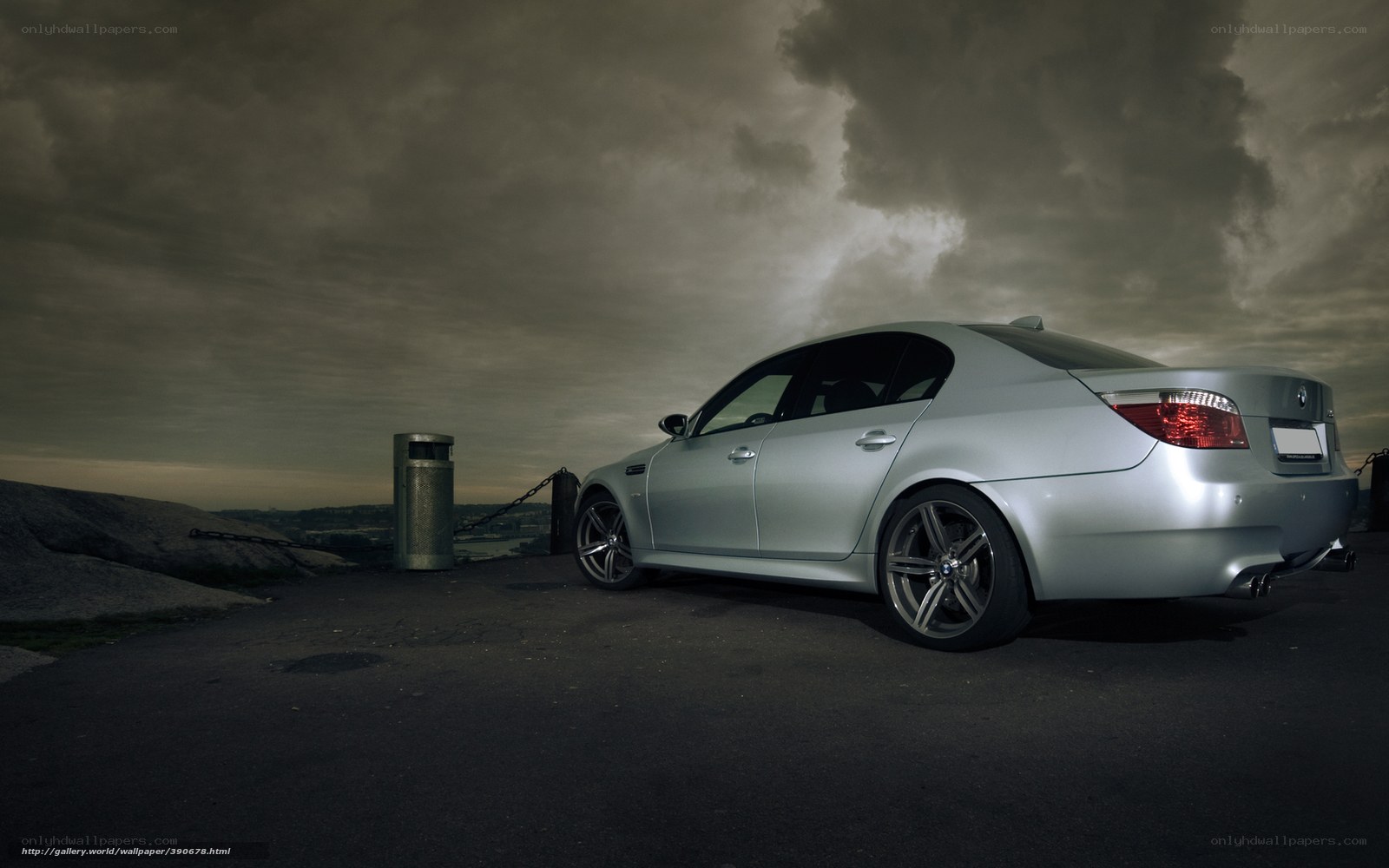 Silver BMW on a stormy overlook