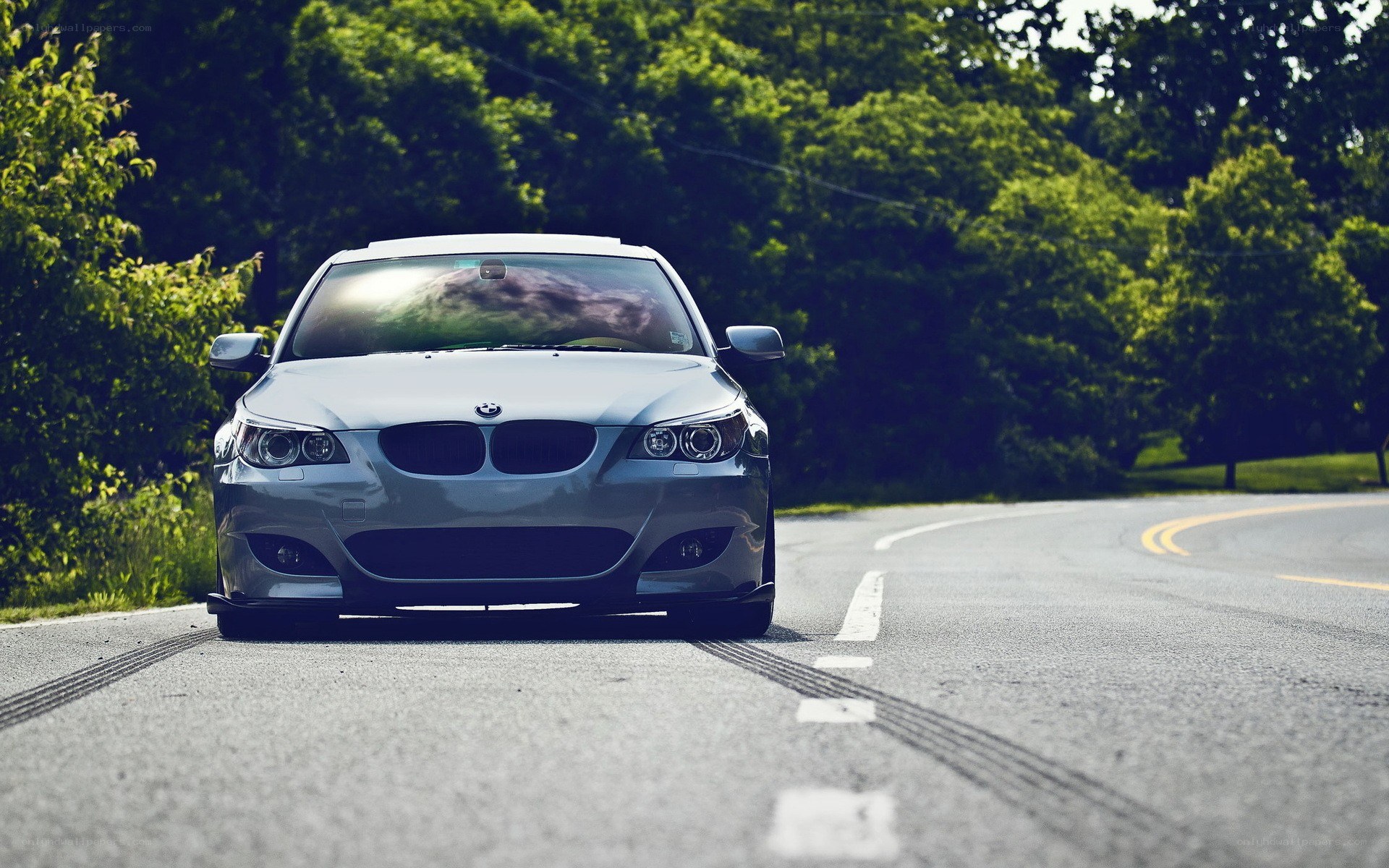 silver bmw on a winding road