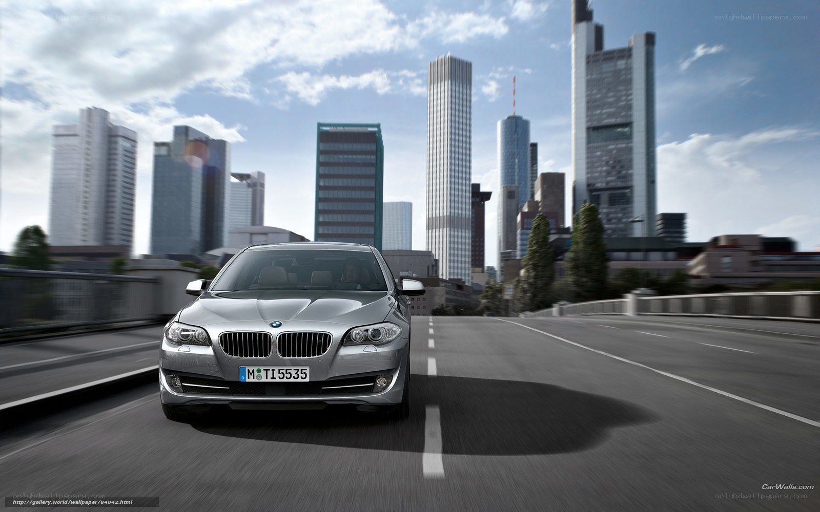 silver bmw on city highway