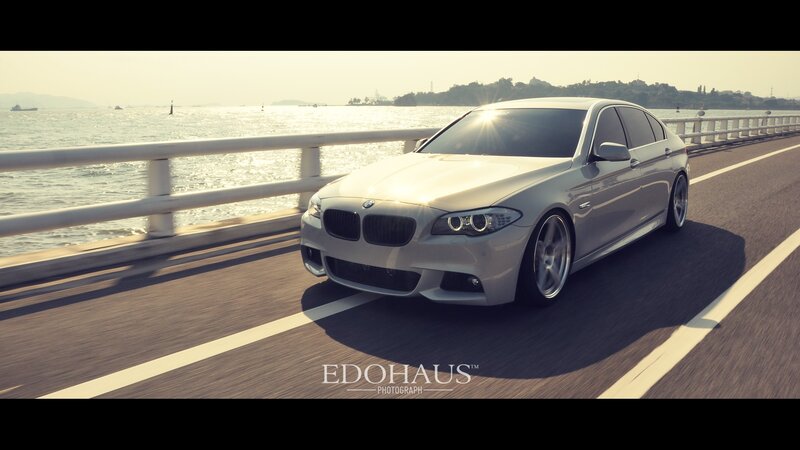 silver bmw on coastal road