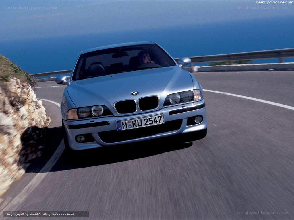 silver bmw on coastal road