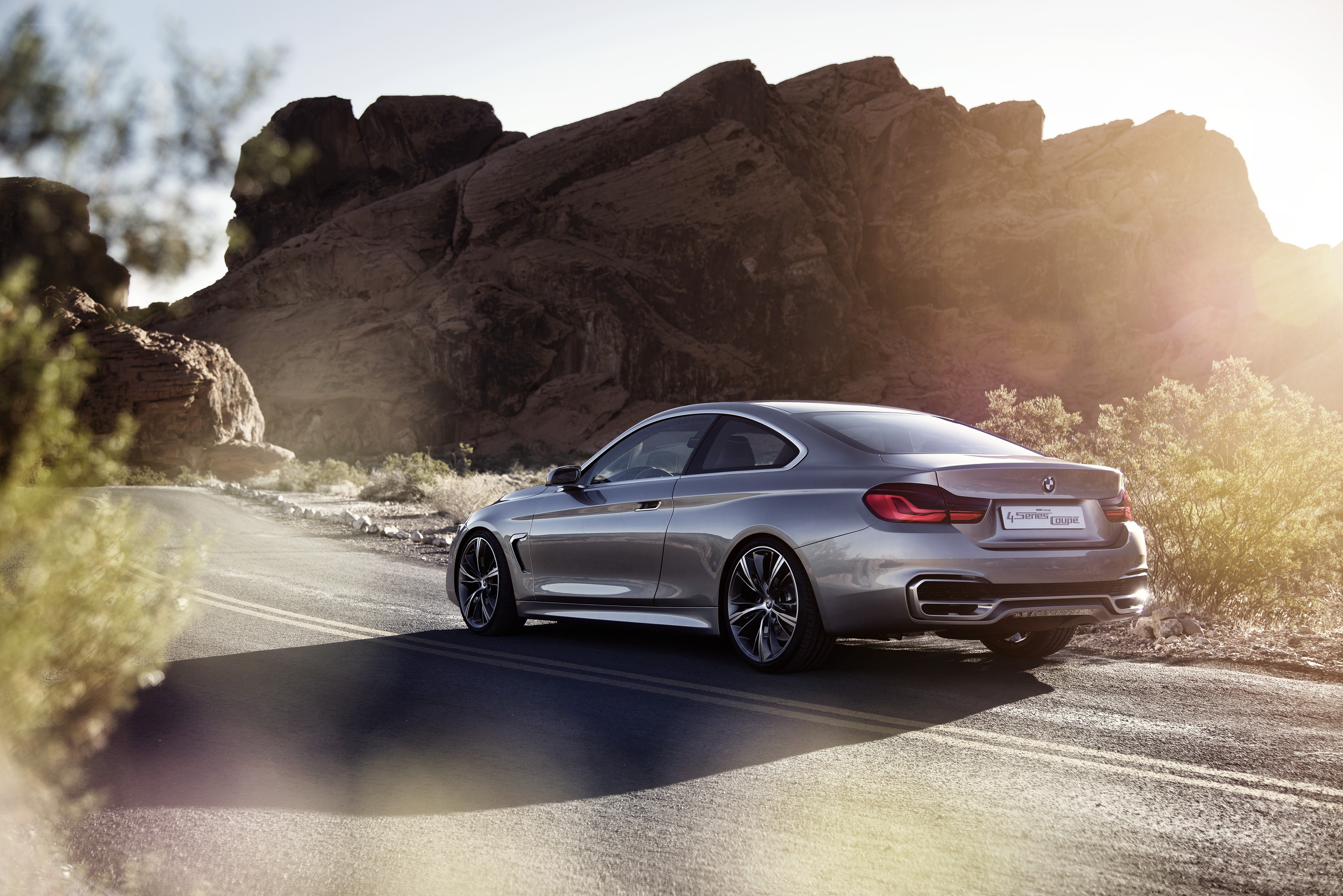 Silver BMW on desert road