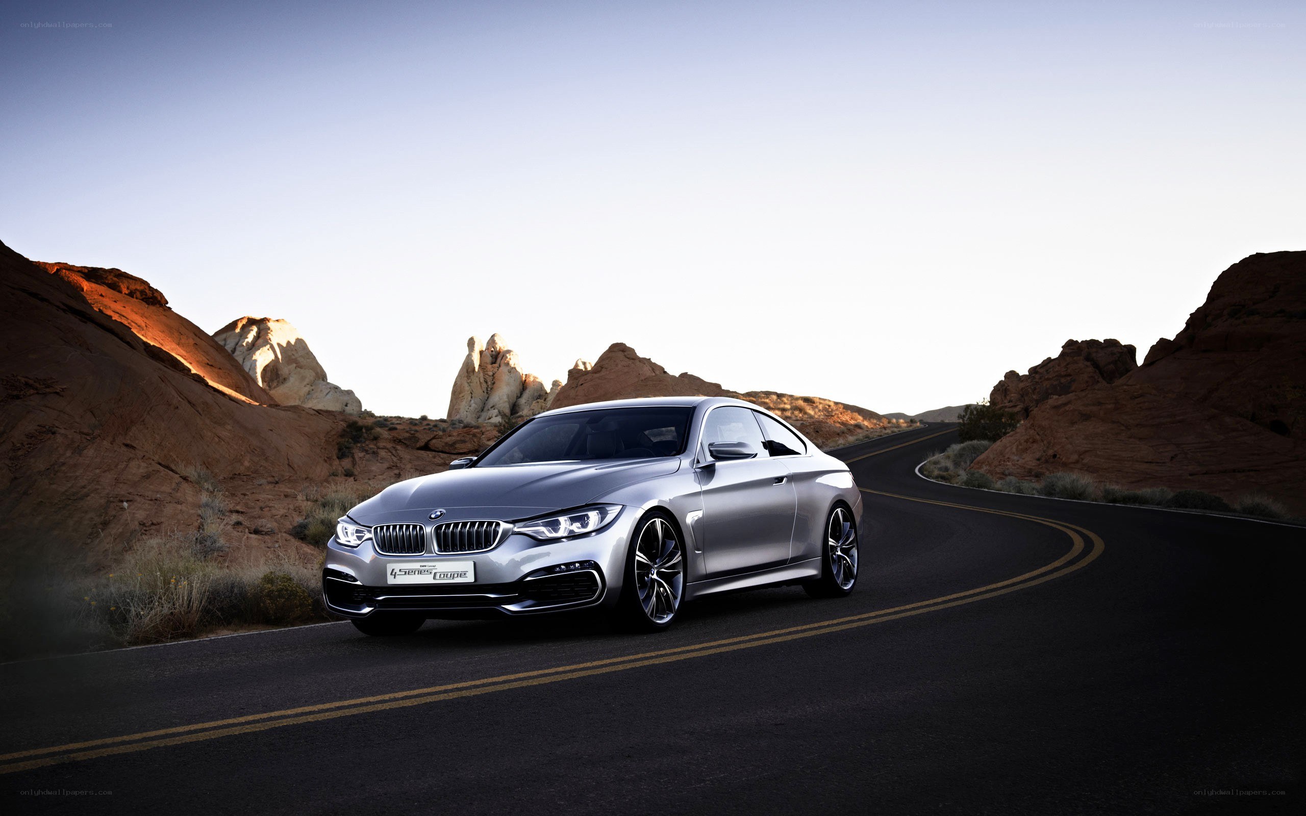 Silver BMW on desert road