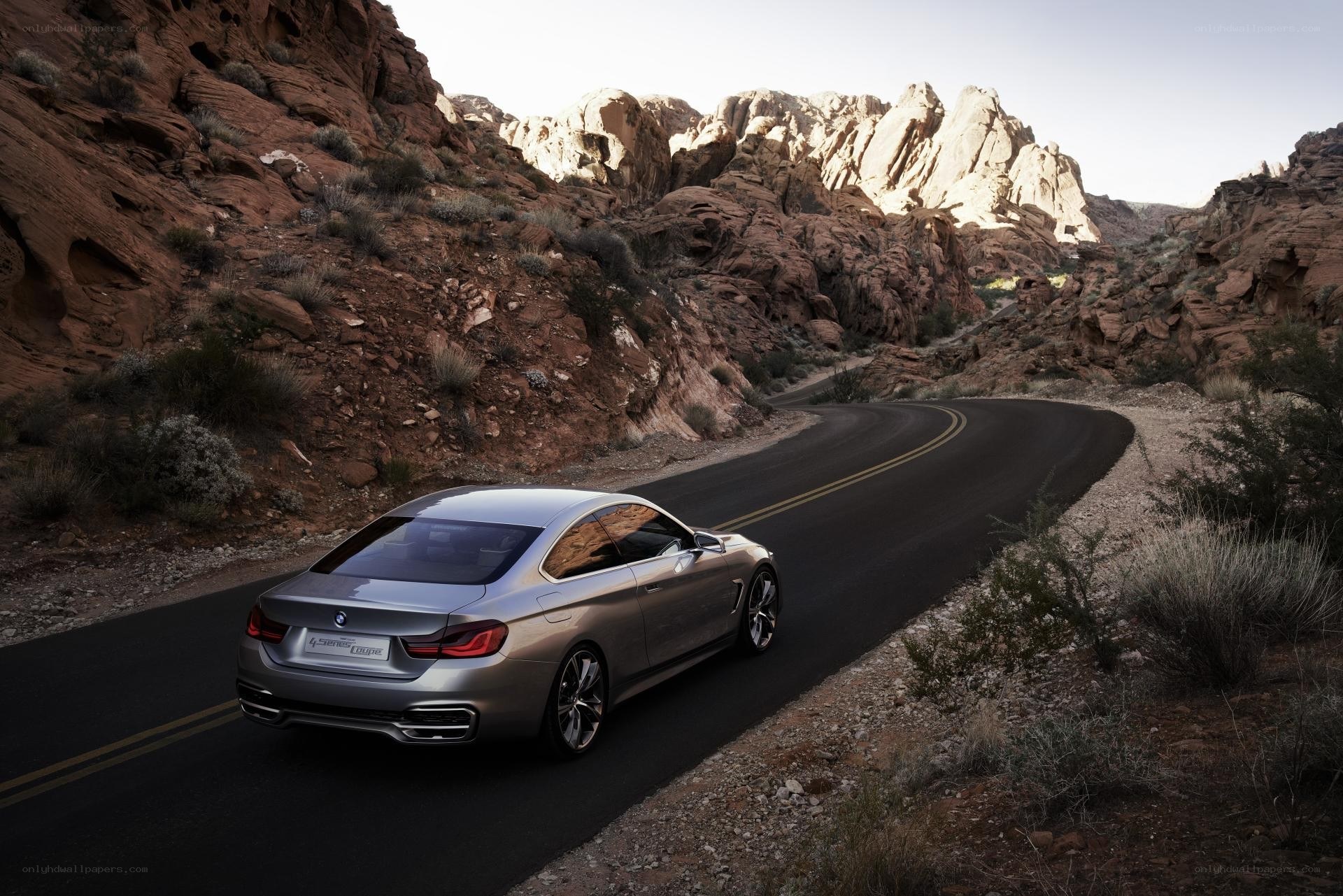 Silver BMW on desert road