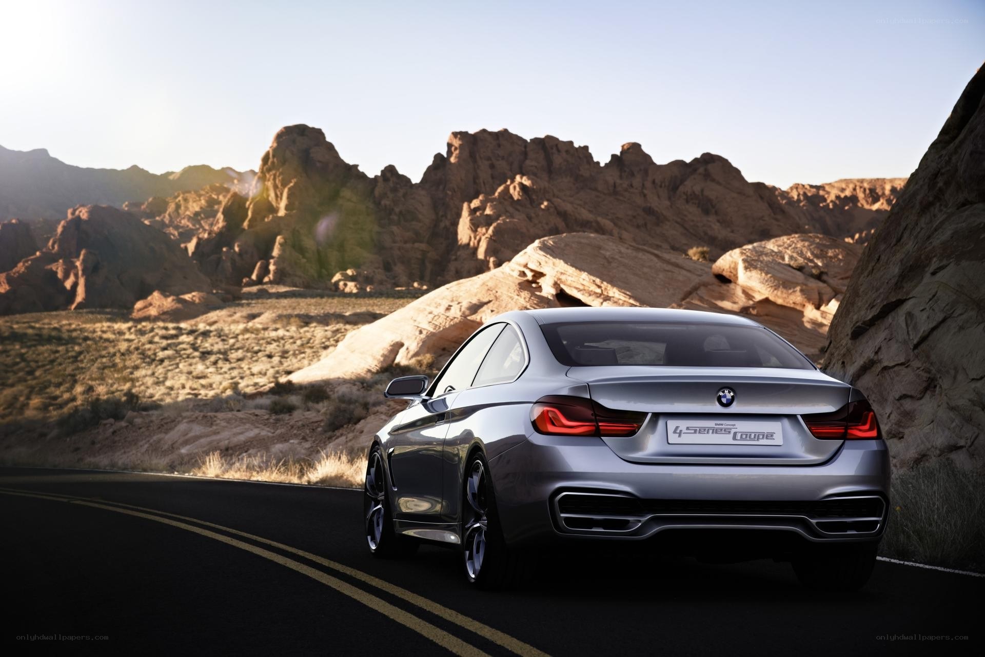 Silver BMW on desert road