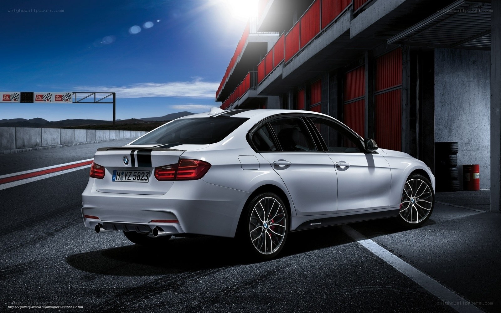 Silver BMW on racetrack