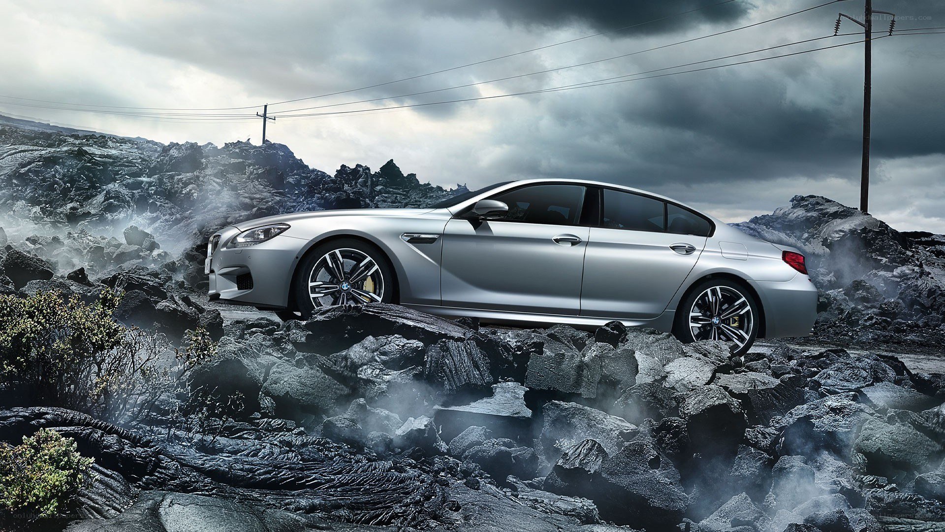 Silver BMW on rocky terrain