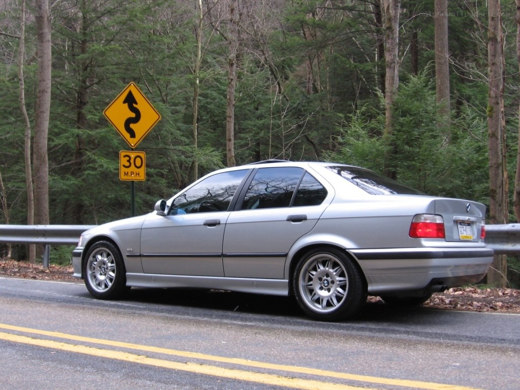 silver bmw on winding road