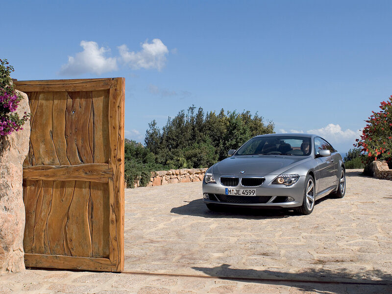 Silver BMW parked at villa entrance