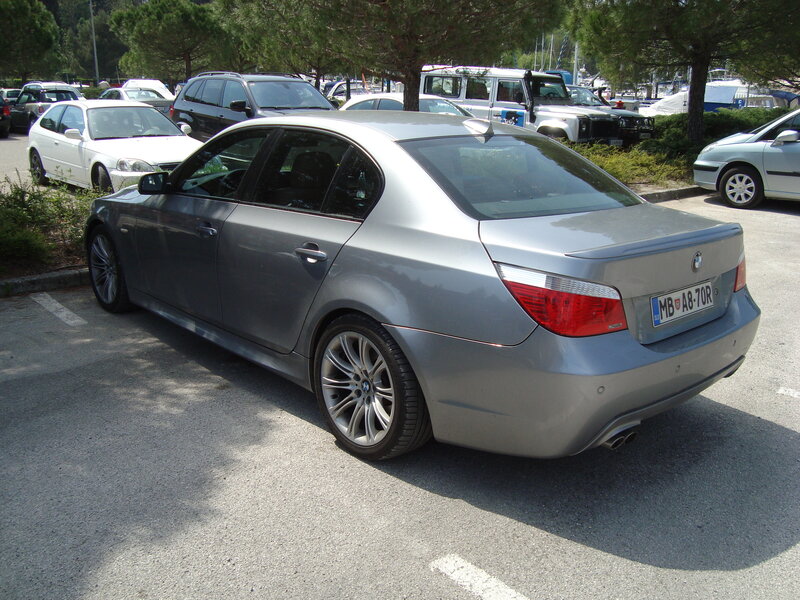 silver bmw parked in lot