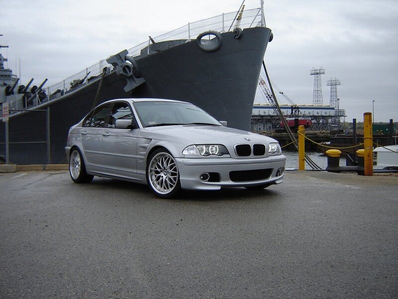 silver bmw sedan at dock