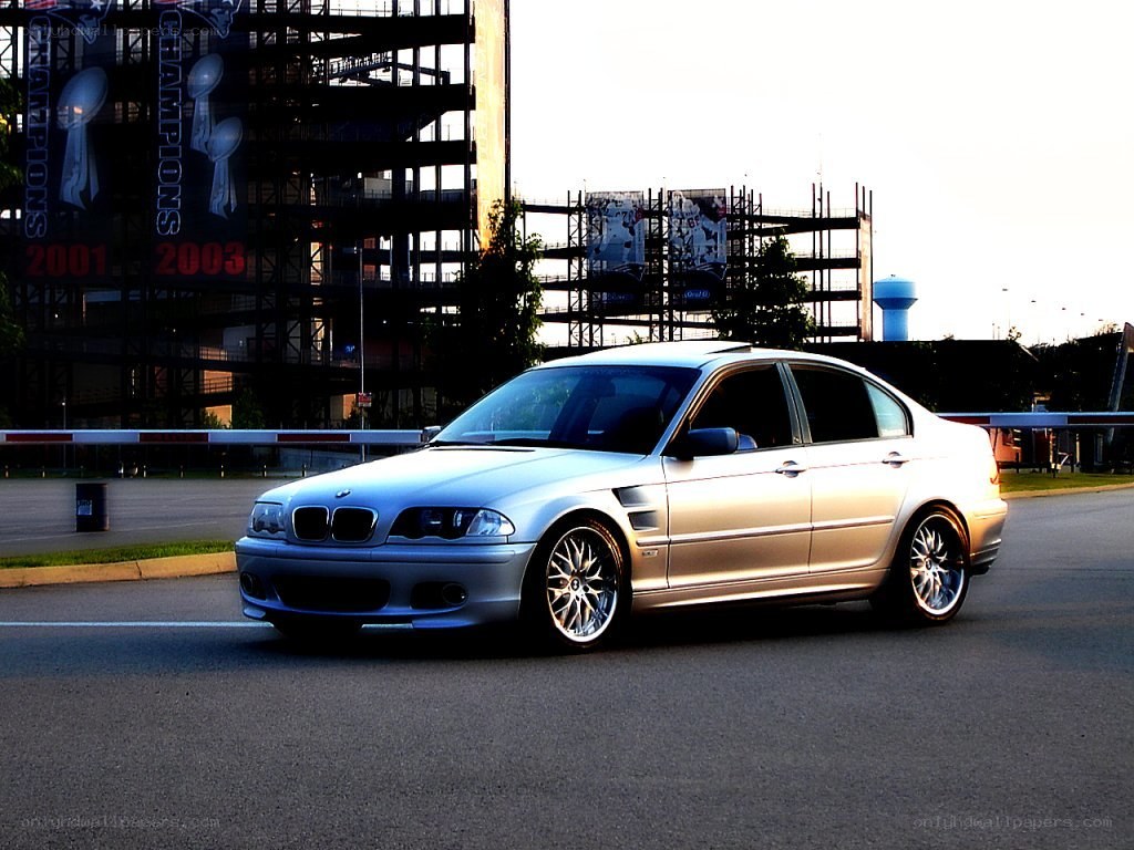 silver bmw sedan at stadium