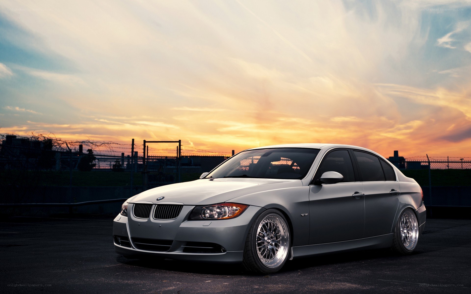silver bmw sedan at sunset