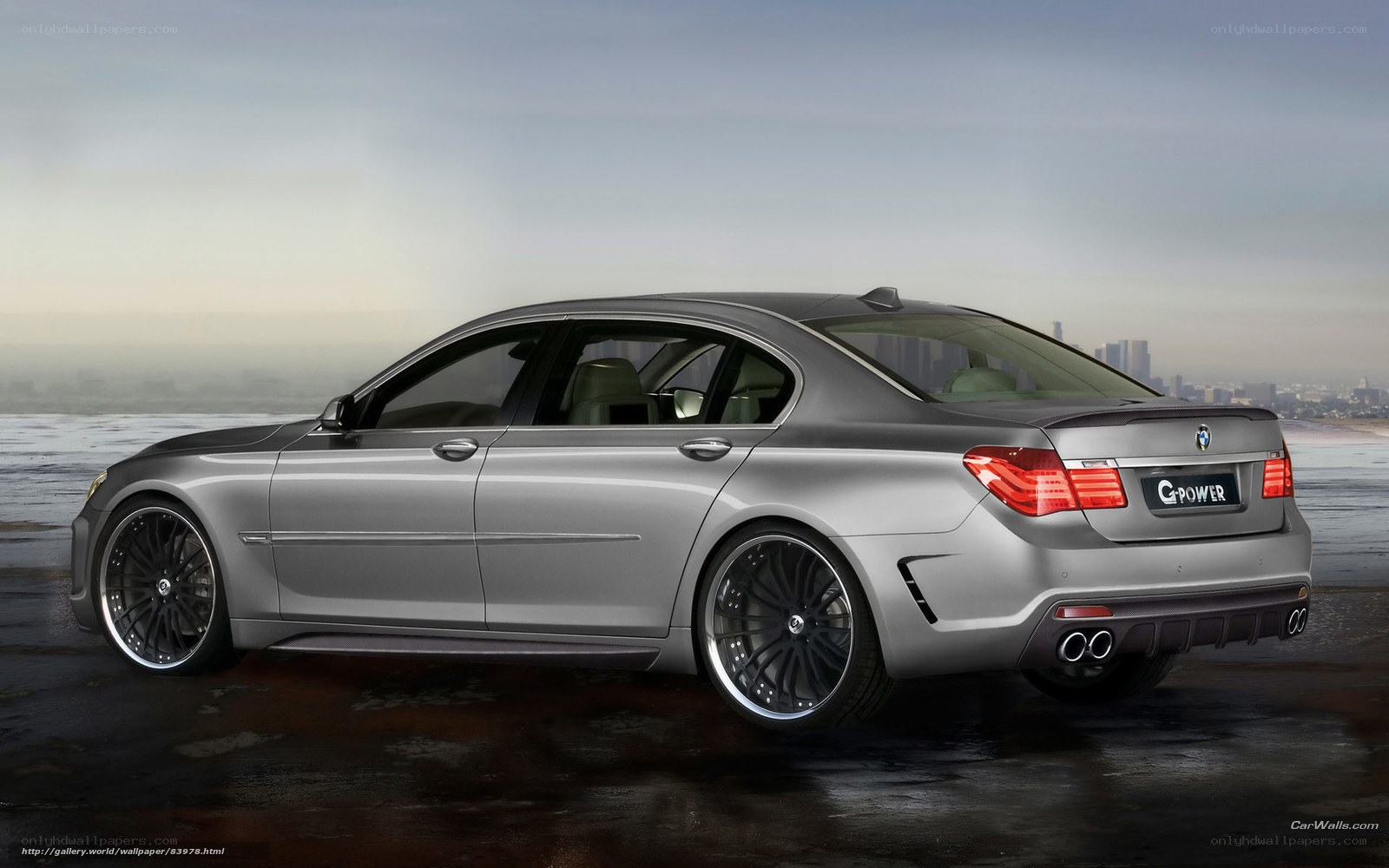 silver bmw sedan by the coast