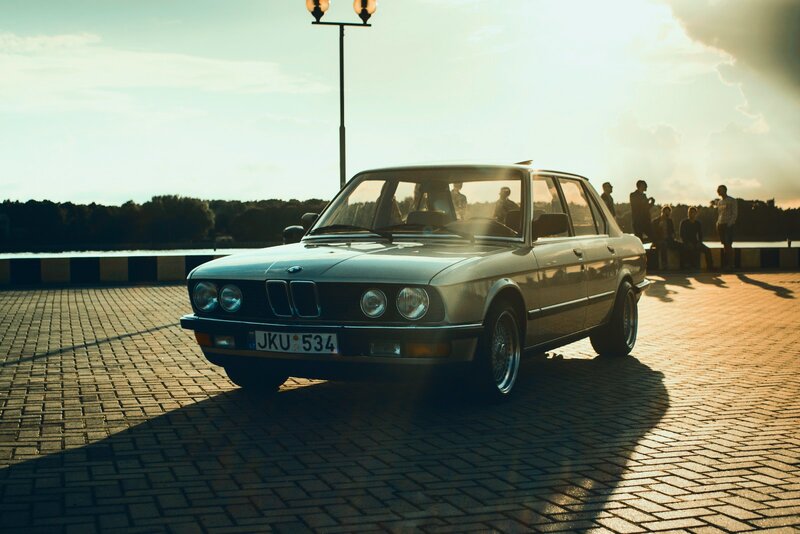 Silver BMW Sedan — Dramatic, Sunset