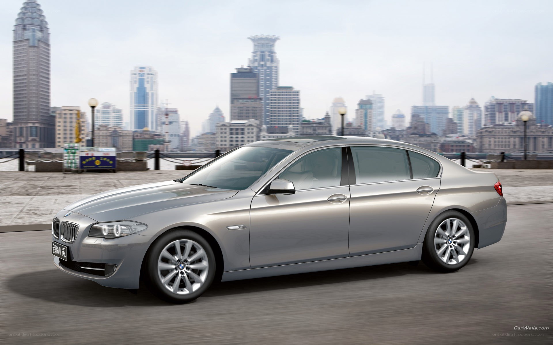 silver bmw sedan in city
