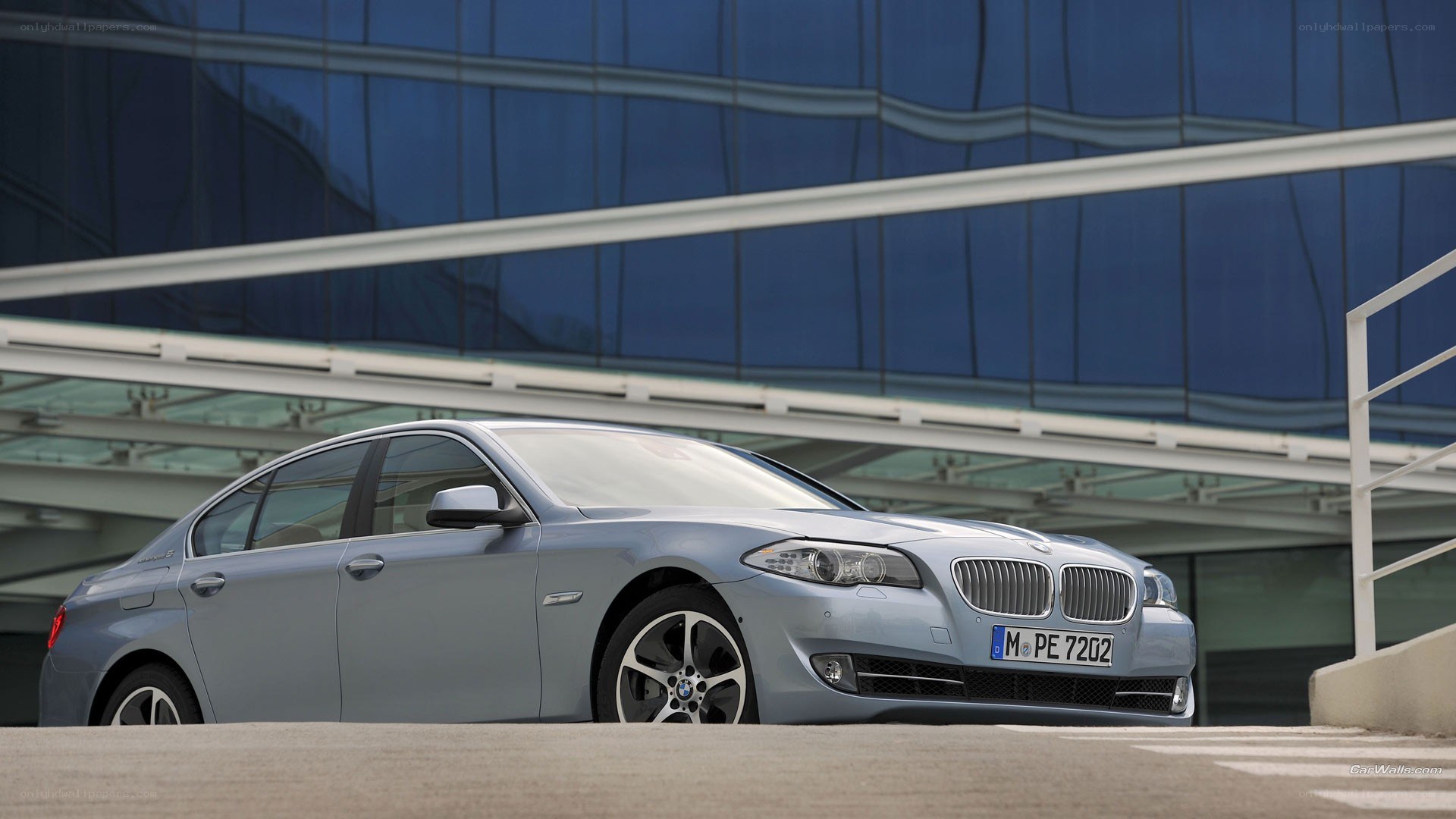 silver bmw sedan in modern setting