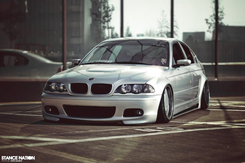 silver bmw sedan in parking lot