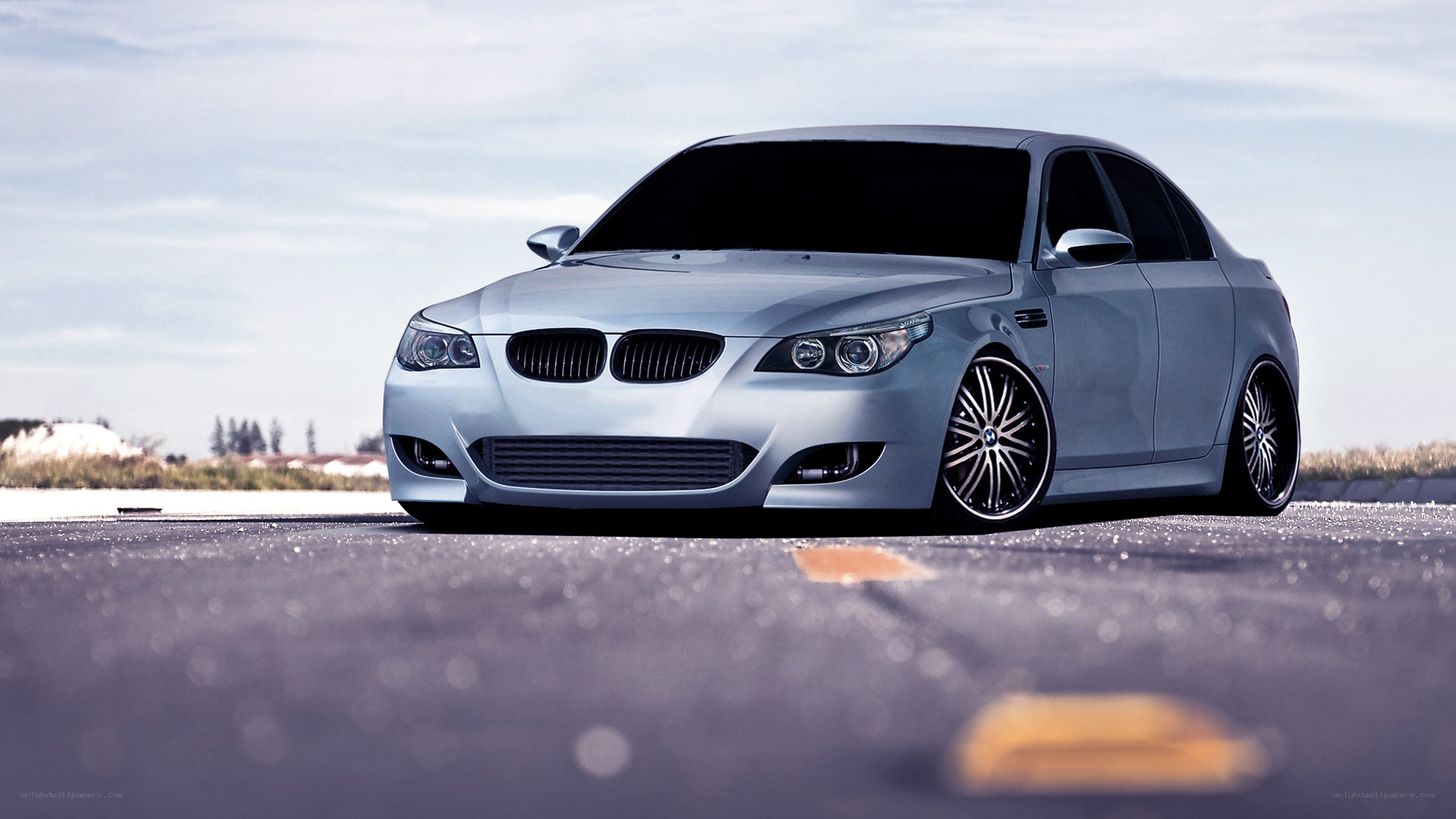 silver bmw sedan on asphalt