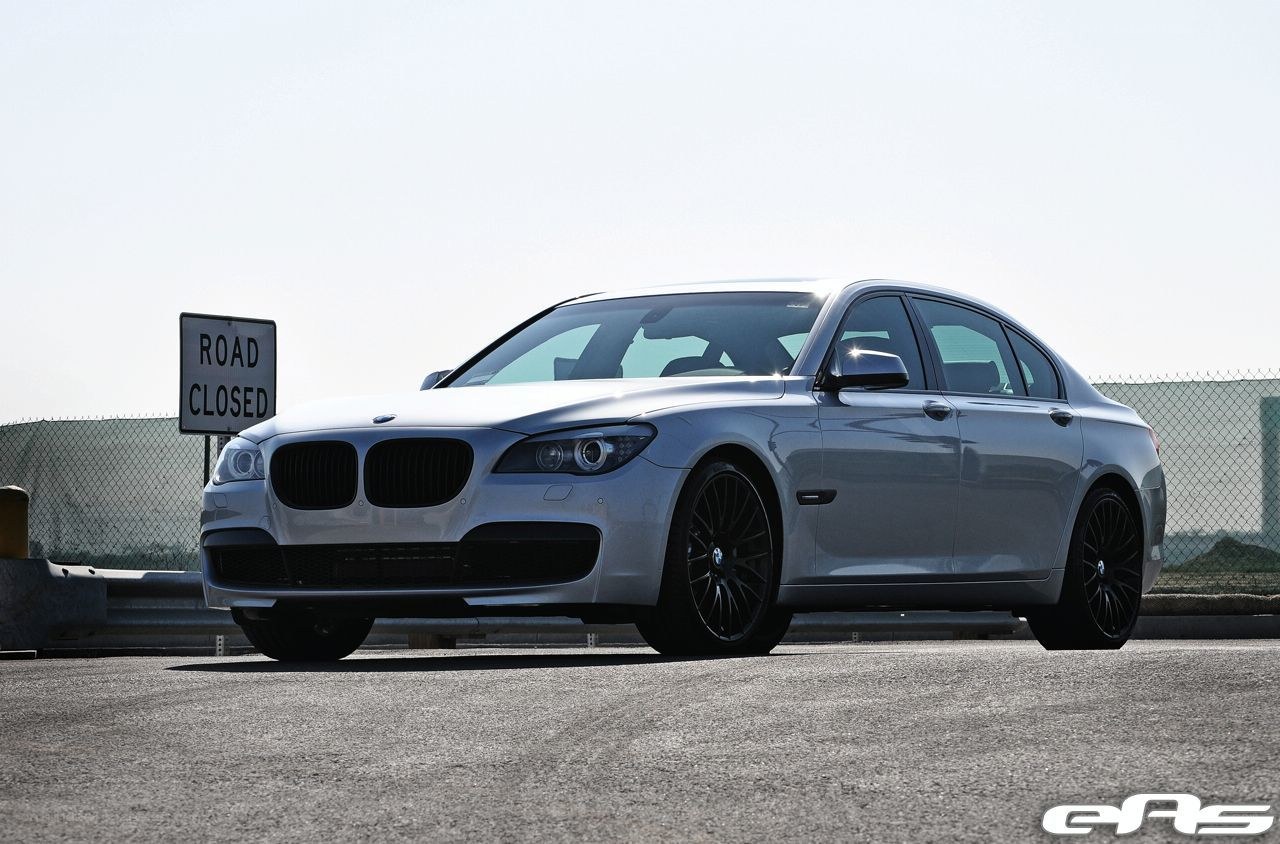 silver bmw sedan on closed road
