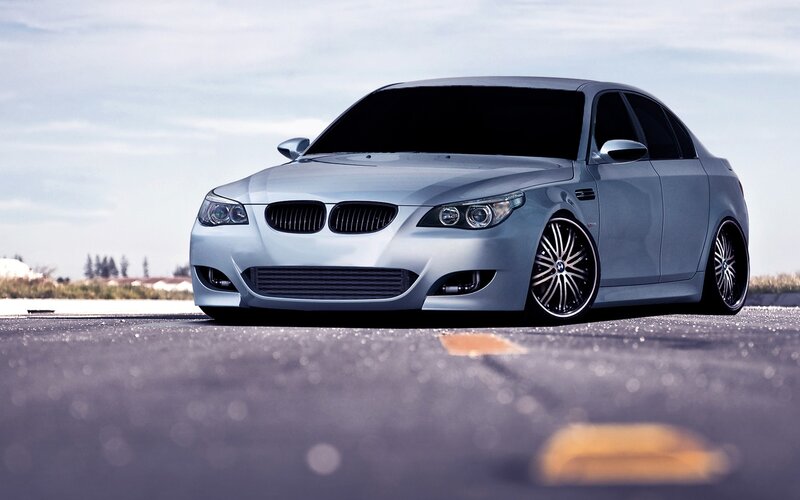 silver bmw sedan on road