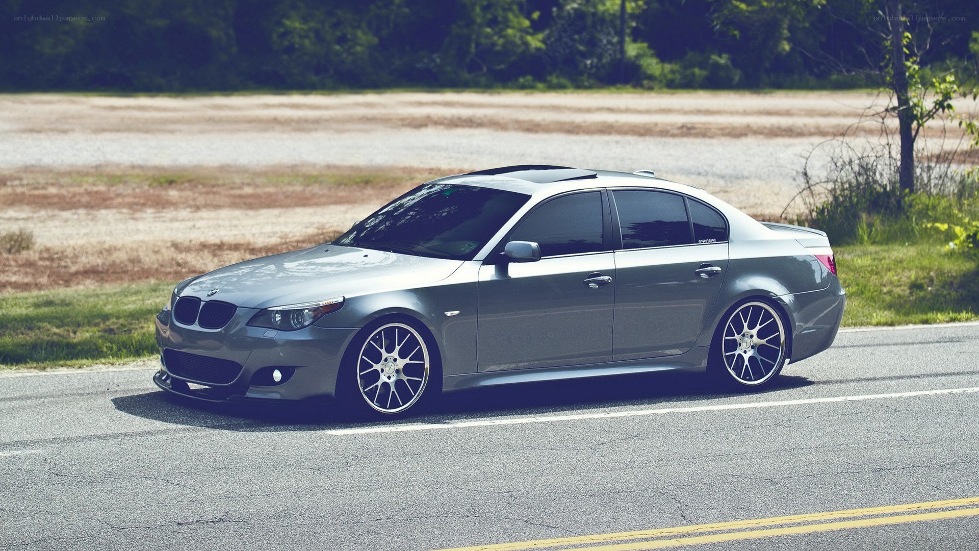 silver bmw sedan on road