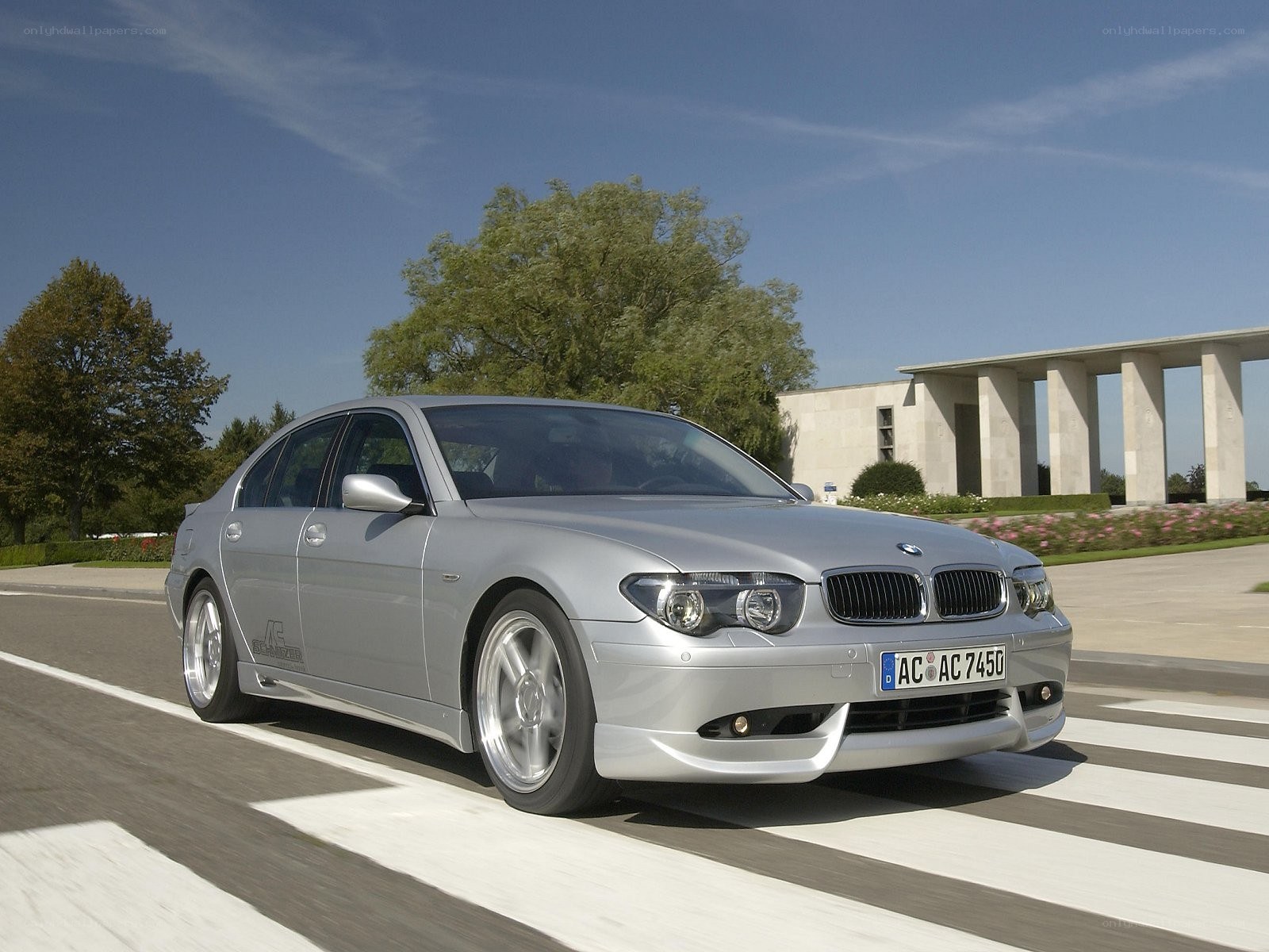 silver bmw sedan on road