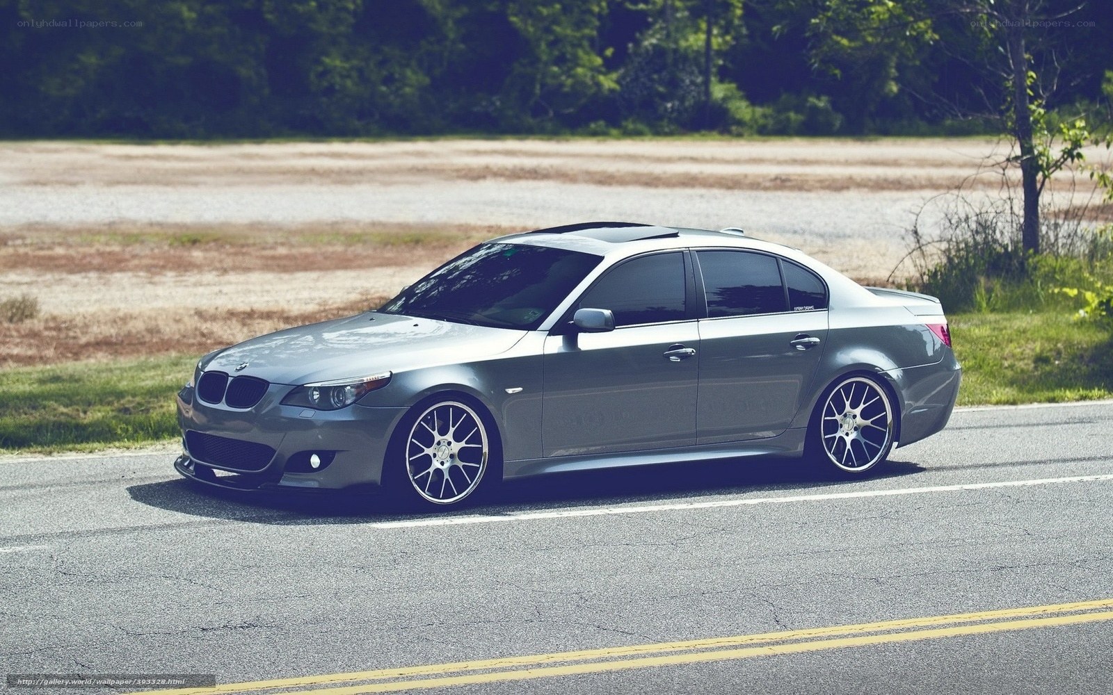 silver bmw sedan on road