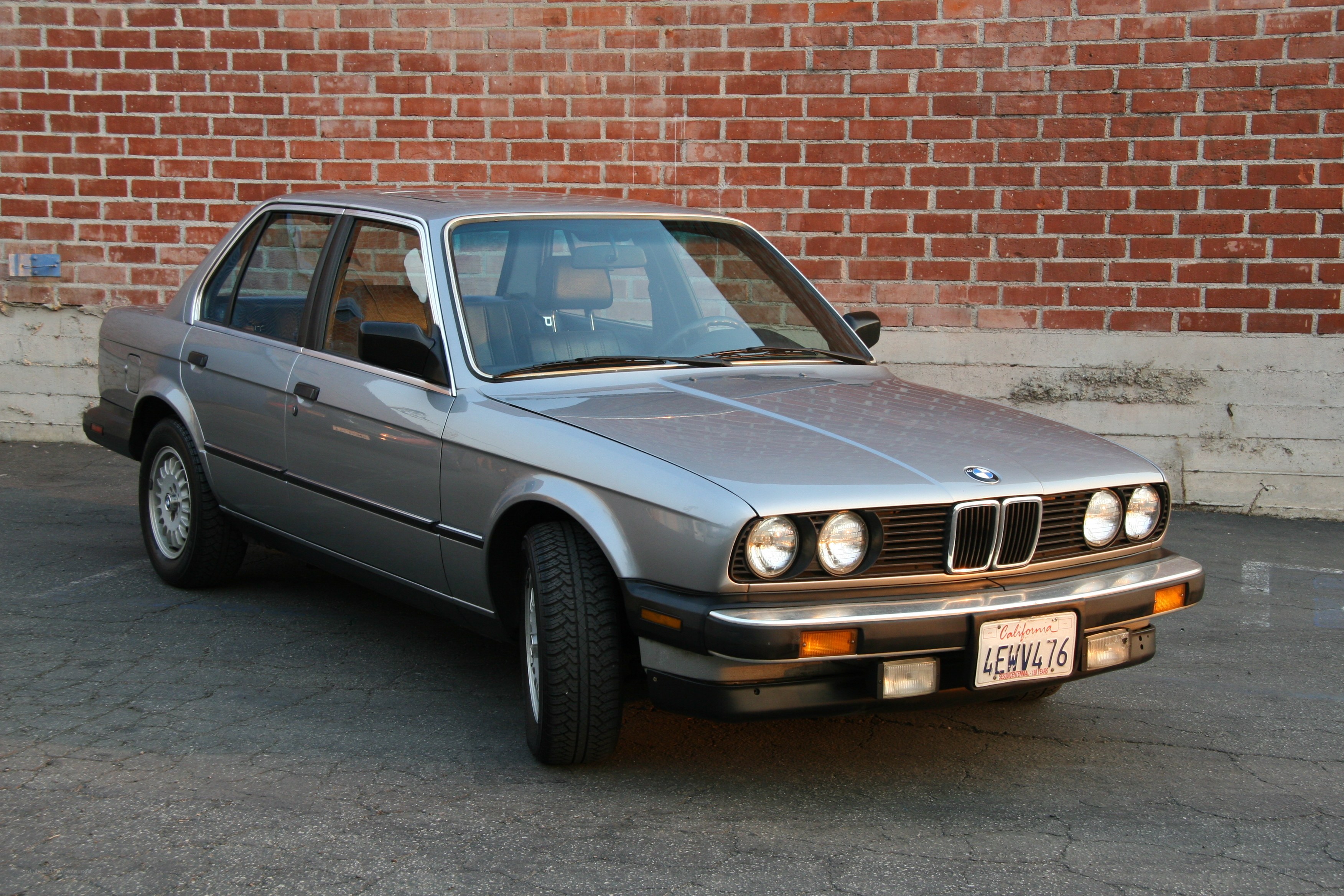silver bmw sedan parked