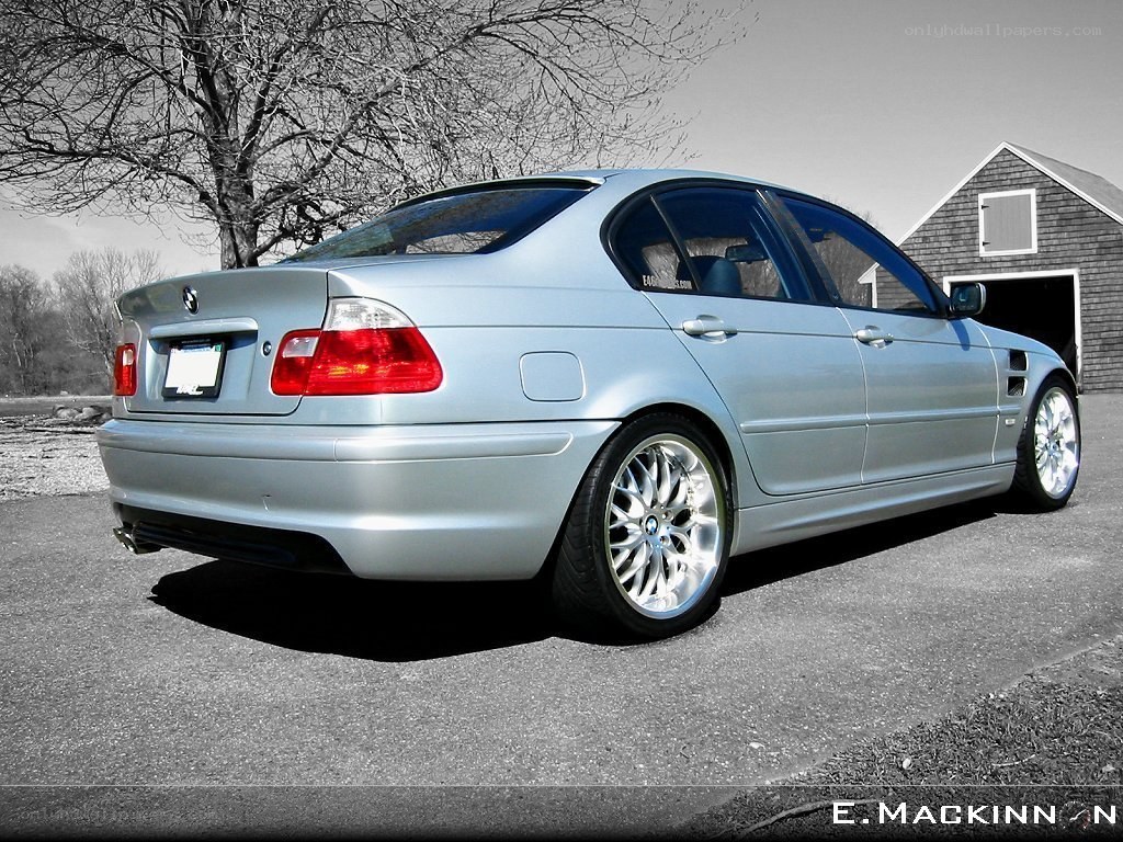 silver bmw sedan parked outside