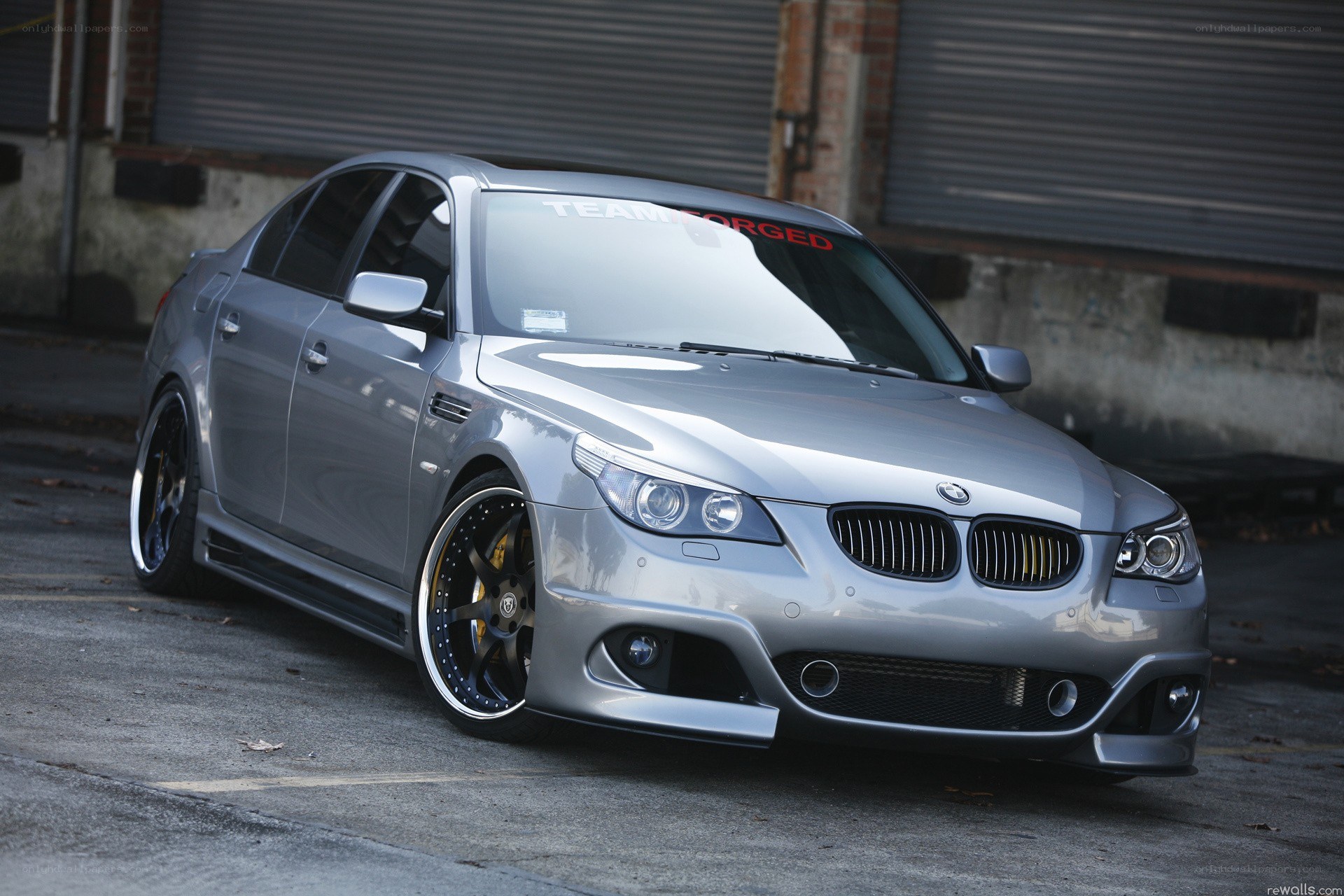 silver bmw sedan with custom wheels