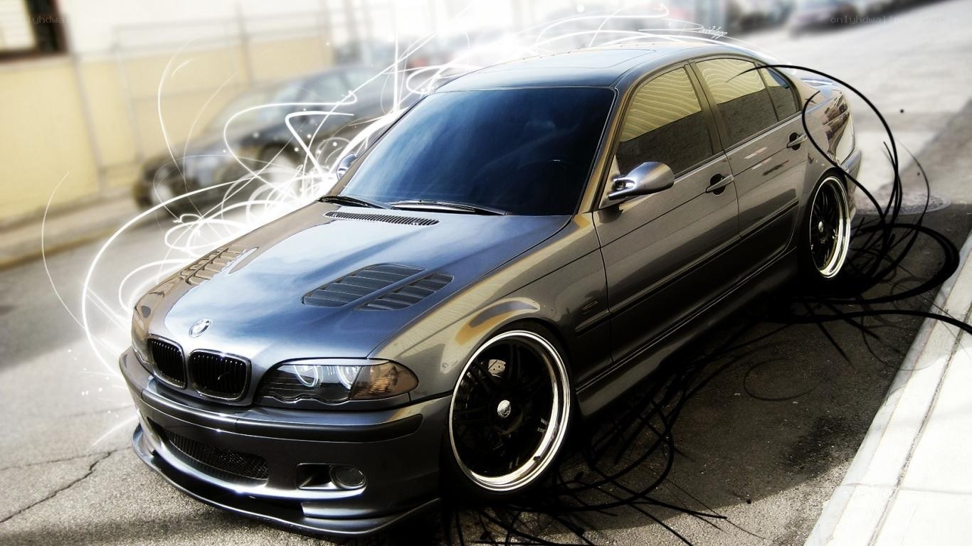 silver bmw sedan with custom wheels