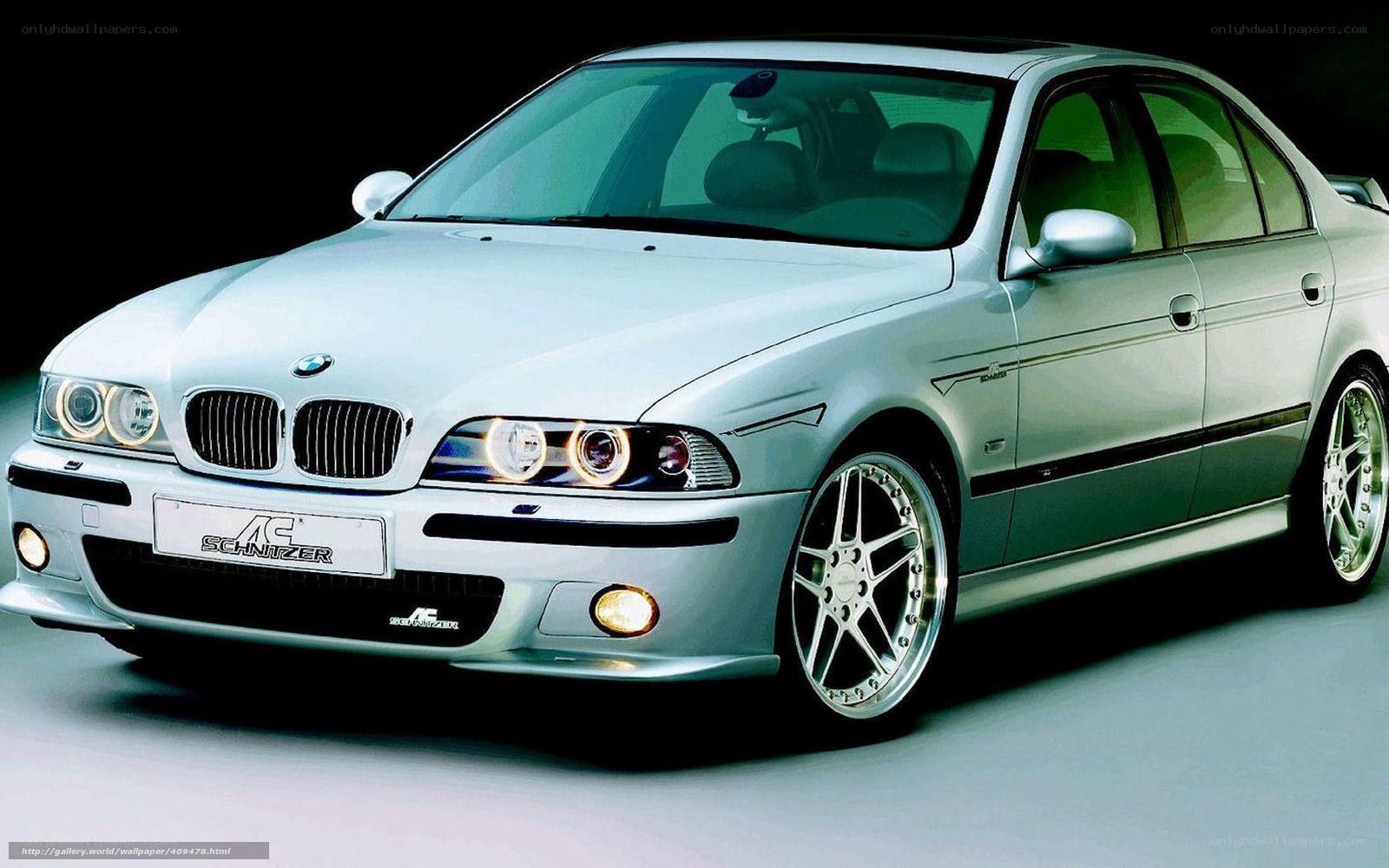 silver bmw sedan with schnitzer