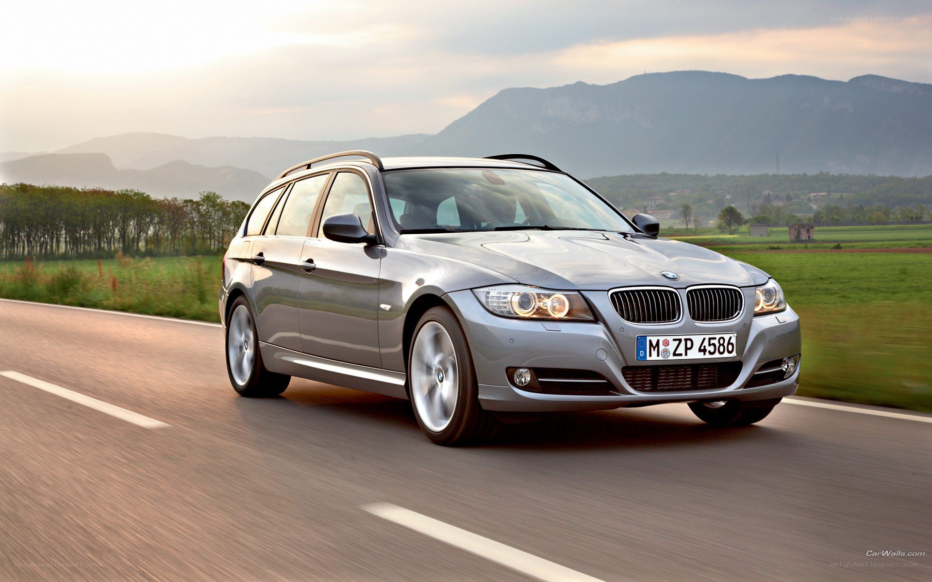 silver bmw station wagon on road