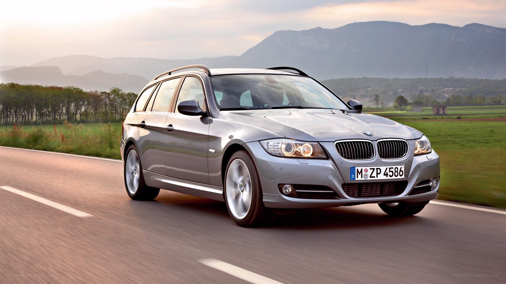 silver bmw station wagon on road