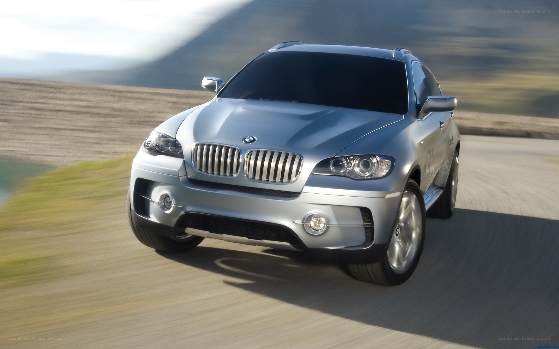 silver bmw suv on road