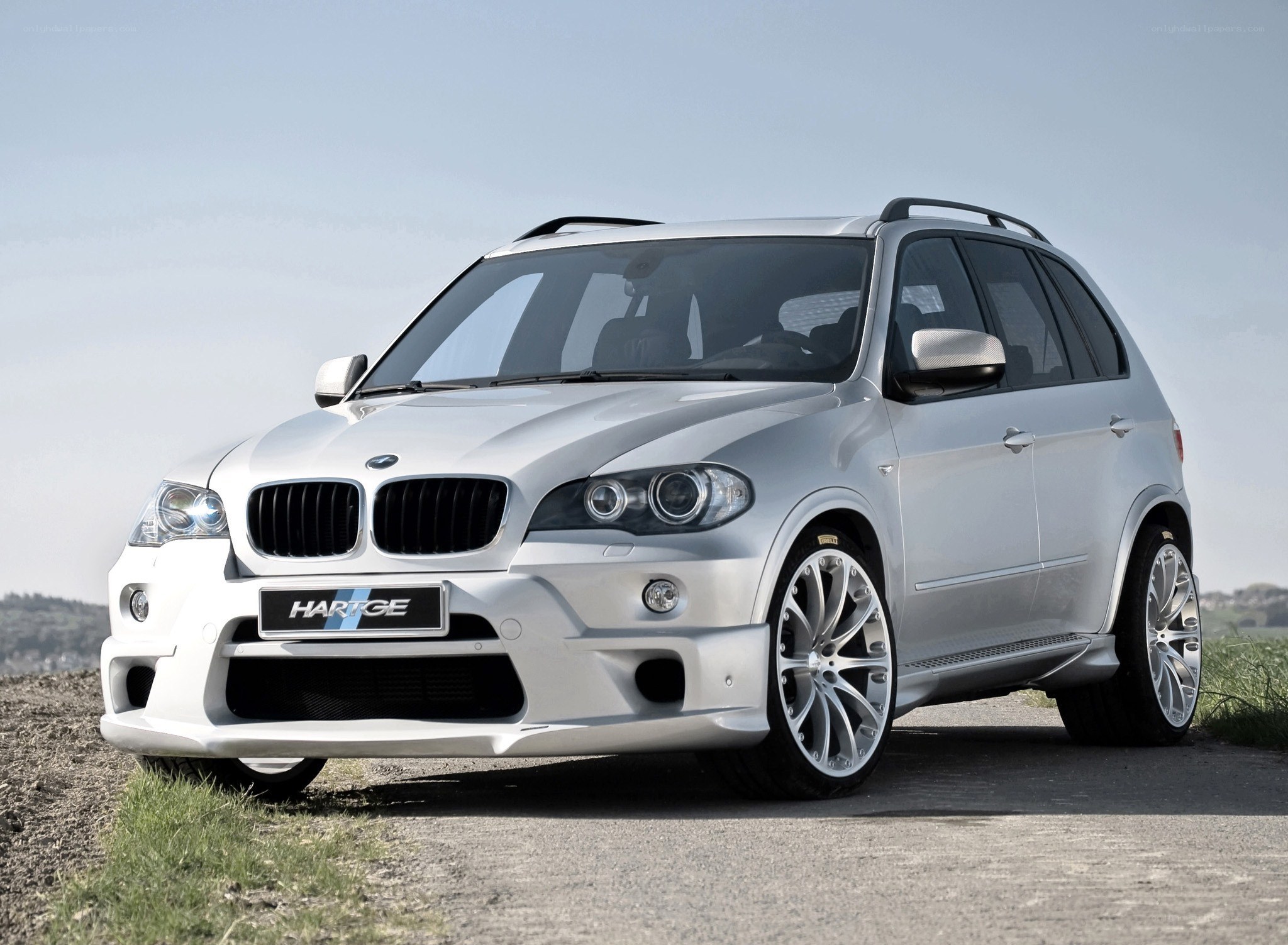 silver bmw suv on road