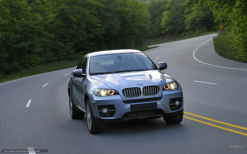silver bmw suv on winding road