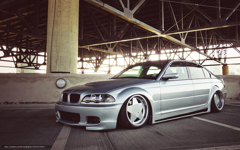 silver bmw under bridge