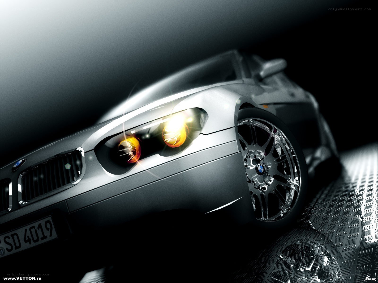 silver bmw with glowing headlights