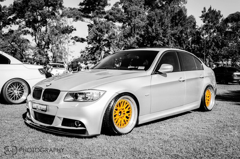 silver bmw with yellow wheels