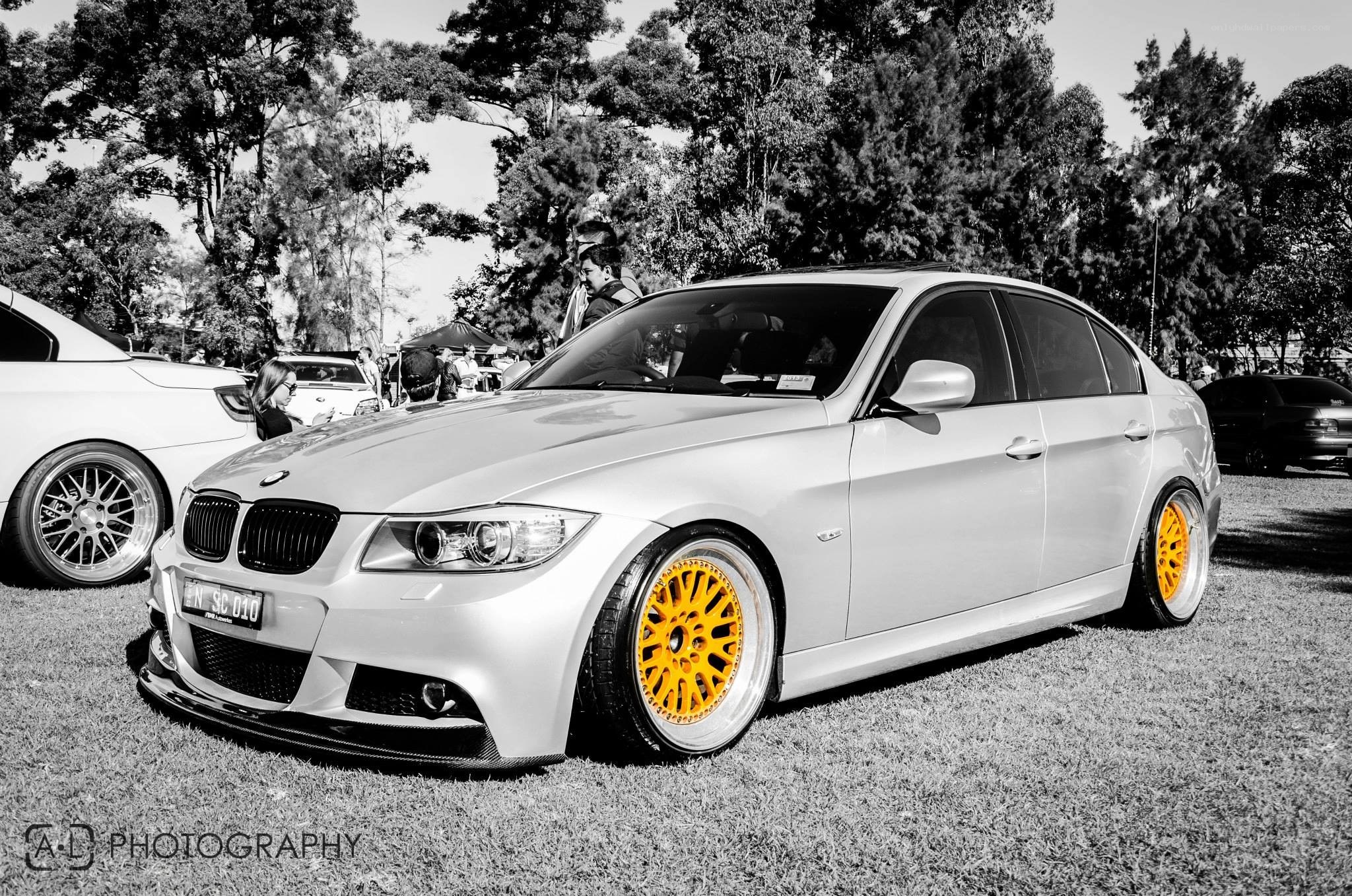 silver bmw with yellow wheels