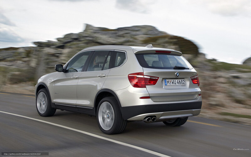 silver bmw x3 driving on road