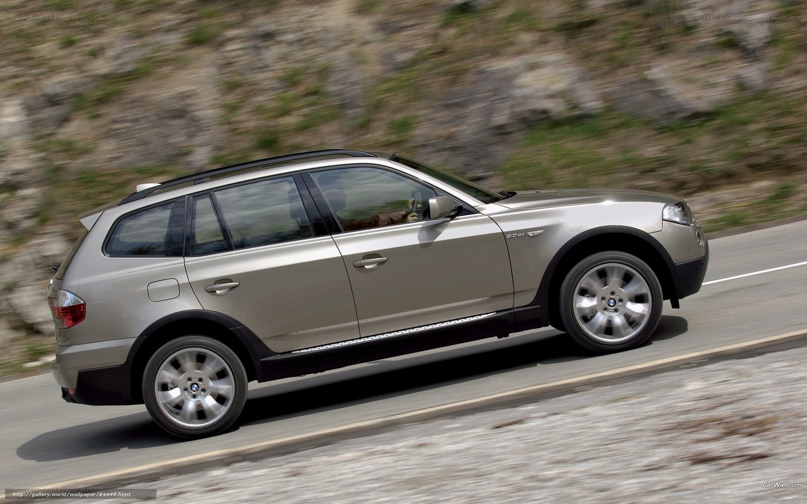 silver bmw x3 in motion